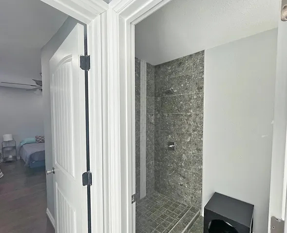 a view of a room that has a large window