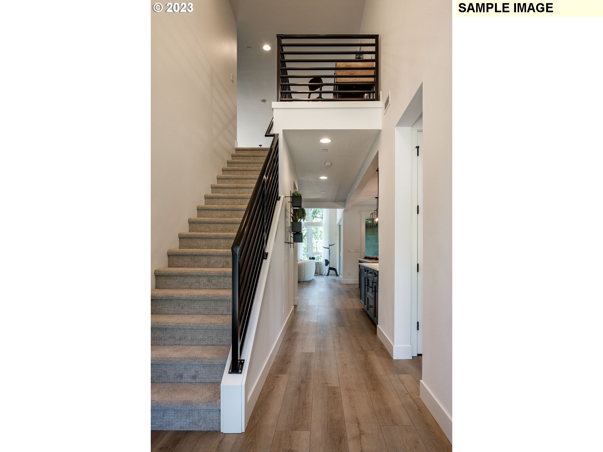 4605 South 13th Way Ridgefield, WA 98642 - Photo 3 of 30 a view of a hallway with wooden floor