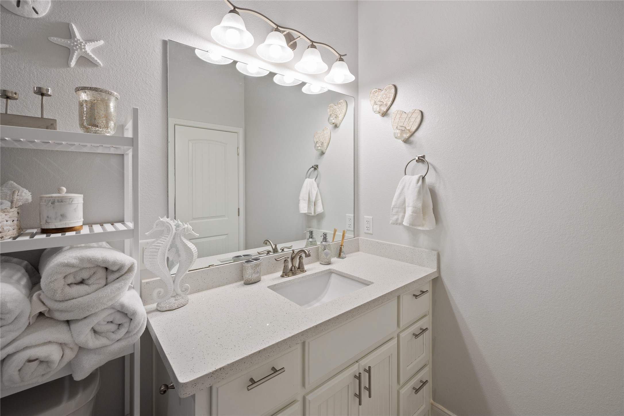 1286 Lagoon Drive Crystal Beach, TX 77650 - Photo 21 of 45 a bathroom with a sink and a mirror