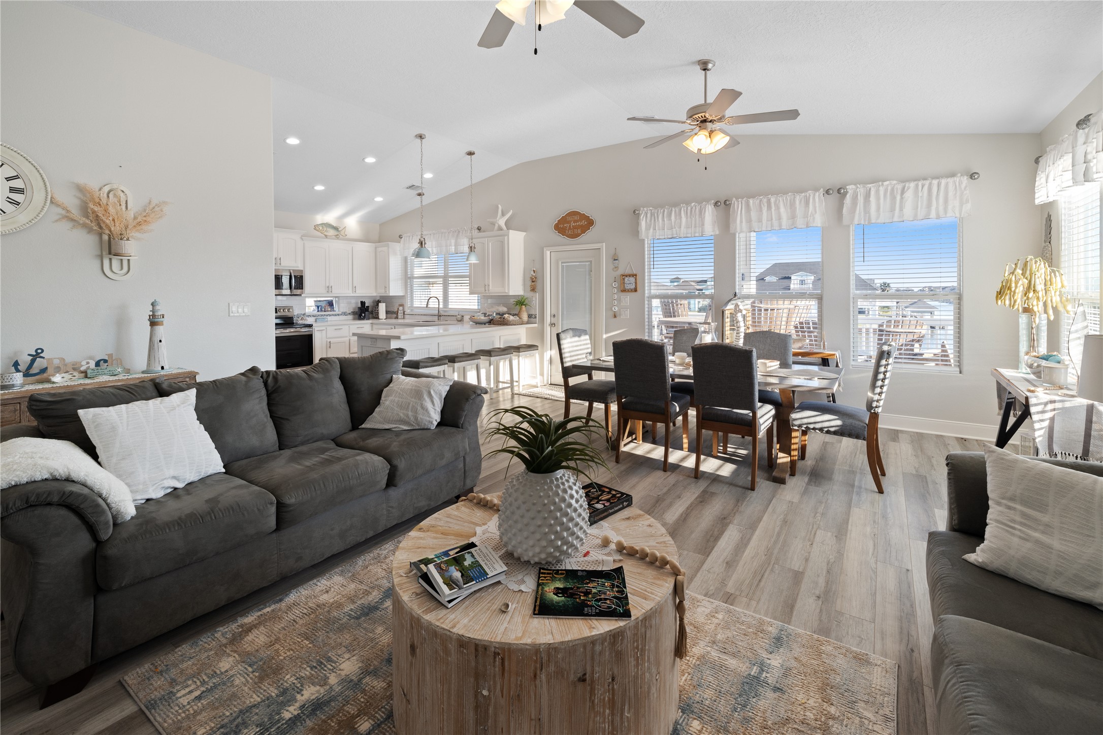 1286 Lagoon Drive Crystal Beach, TX 77650 - Photo 29 of 45 a living room with furniture kitchen view and a chandelier
