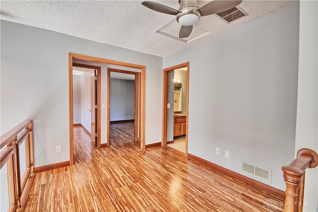 8711 Nicole Lane Springboro, OH 45066 - Photo 32 of 87 This interior space showcases polished hardwood flooring and natural wood trim.