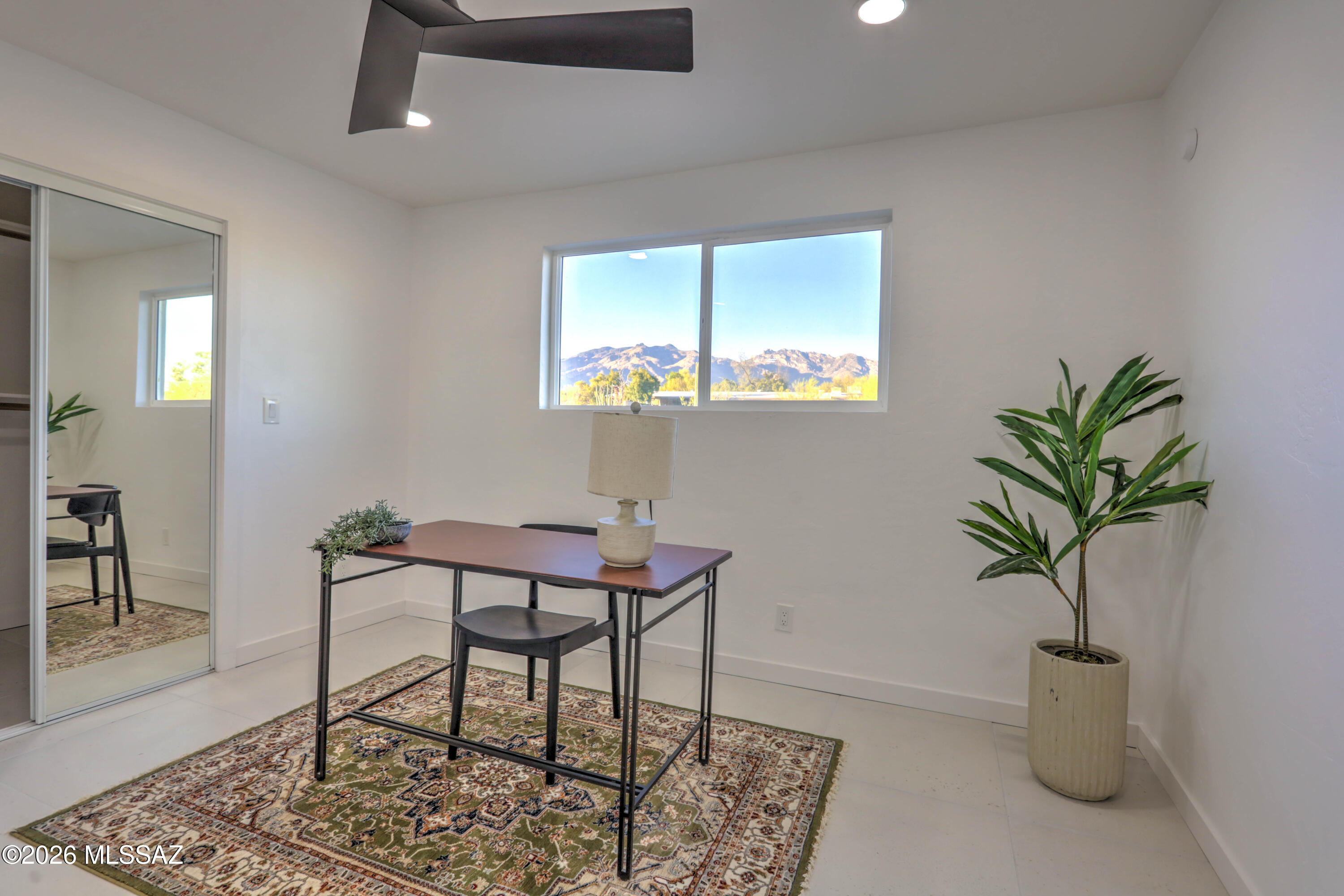4939 East River Road Tucson, AZ 85718 - Photo 8 of 29 a view of a livingroom with furniture and a potted plant