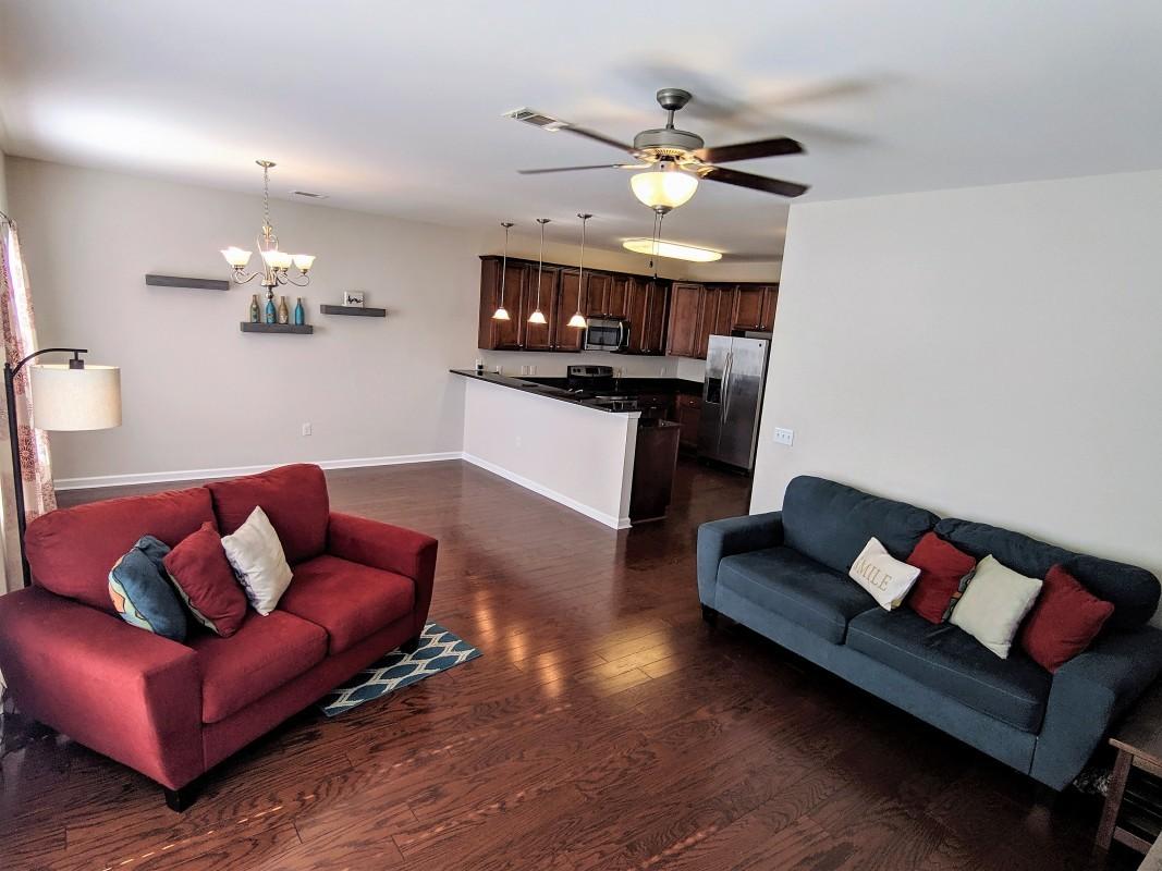 116 Matt Boulevard Niceville, FL 32578 - Photo 3 of 6 a living room with furniture and a wooden floor