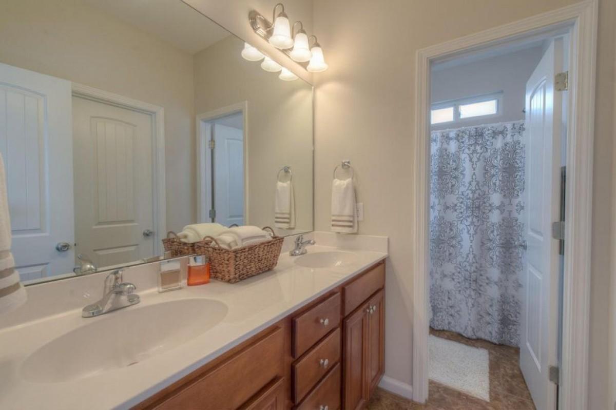116 Matt Boulevard Niceville, FL 32578 - Photo 5 of 6 a bathroom with a sink double vanity and a mirror
