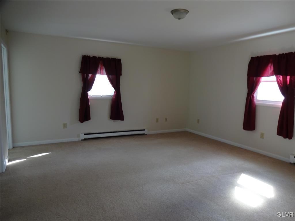 2325 Stonehenge Road Bethlehem, PA 18018 - Photo 11 of 14 an empty room with wooden floor and windows