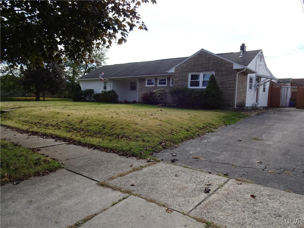 2325 Stonehenge Road Bethlehem, PA 18018 - Photo 2 of 14 a front view of a house with a yard and garage