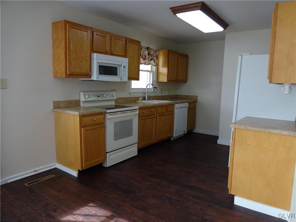 2325 Stonehenge Road Bethlehem, PA 18018 - Photo 9 of 14 a kitchen with stainless steel appliances a stove a sink and a microwave
