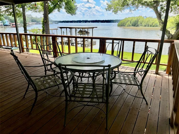 a view of a balcony with chairs