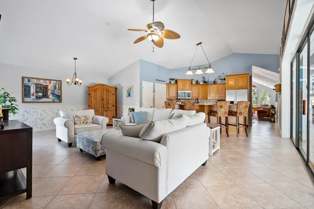 a spacious bedroom with a bed and glass door