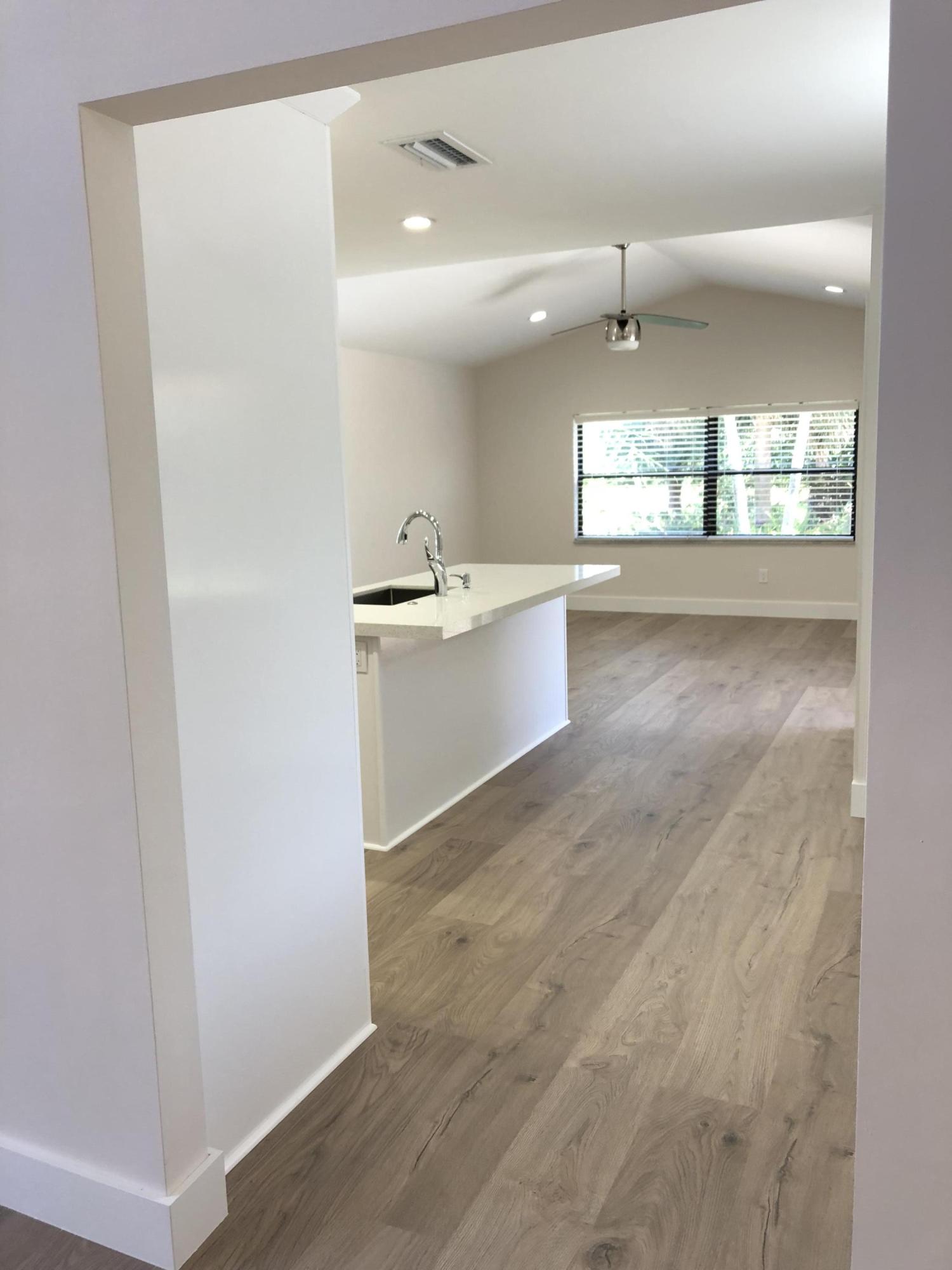 23204 L'Ermitage Circle Boca Raton, FL 33433 - Photo 8 of 49 Entry to kitchen and family room