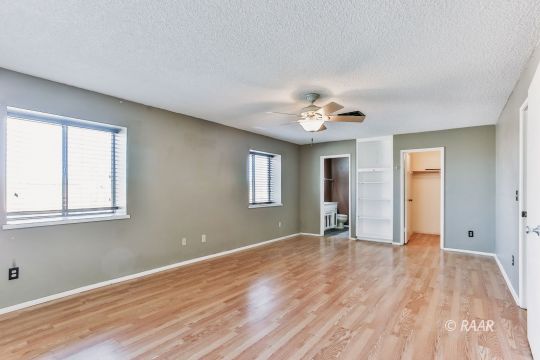 236 Richard Court Ridgecrest, CA 93555 - Photo 16 of 29 a view of an empty room with wooden floor and a window