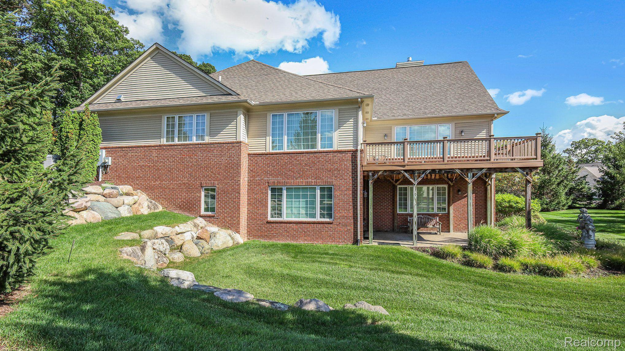 Side Elevation w/ upper deck and lower level patio