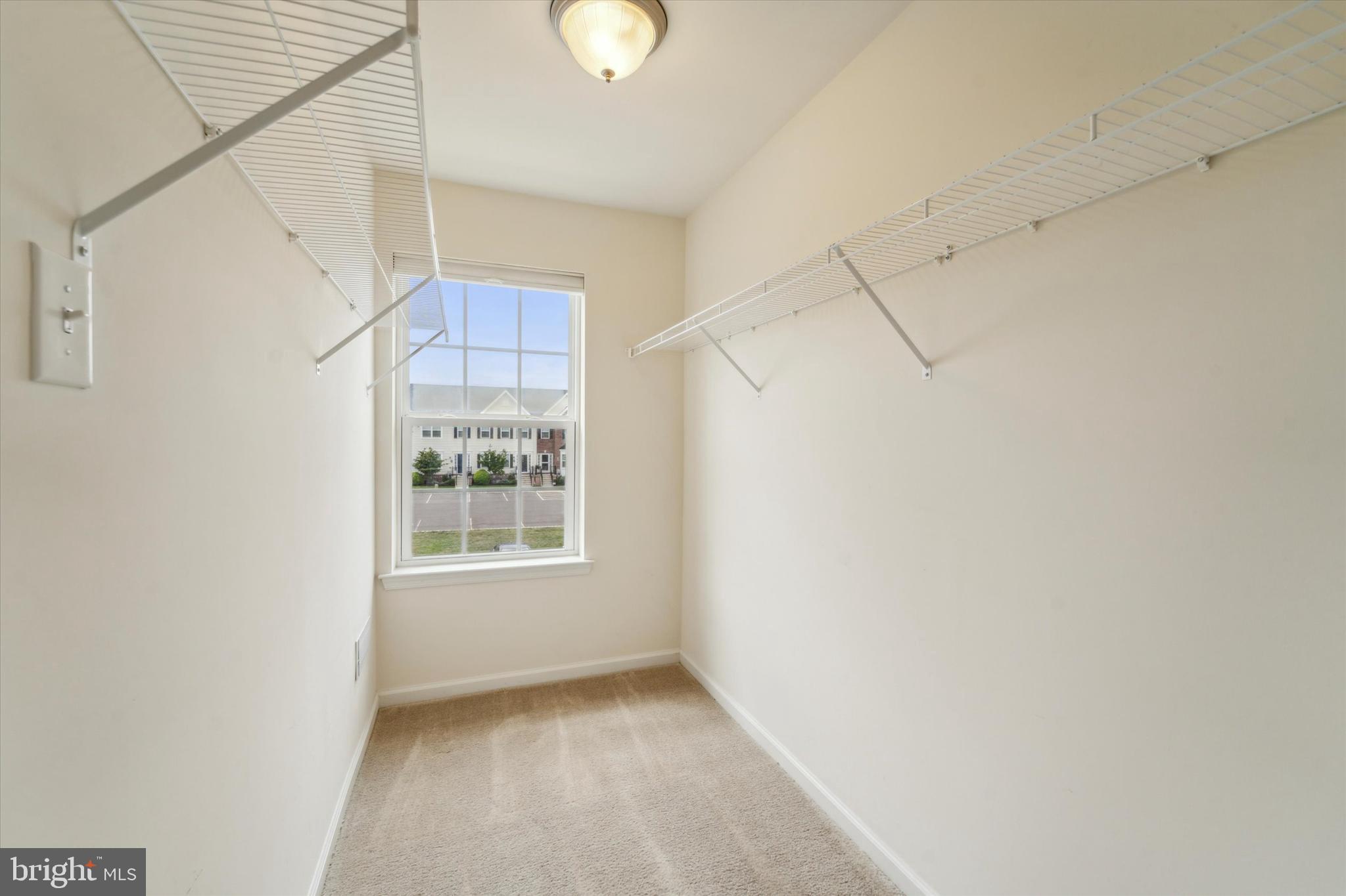 3799 Jacob Stout Road, Unit 5 Doylestown, PA 18902 - Photo 11 of 25 a view of an empty room with a window