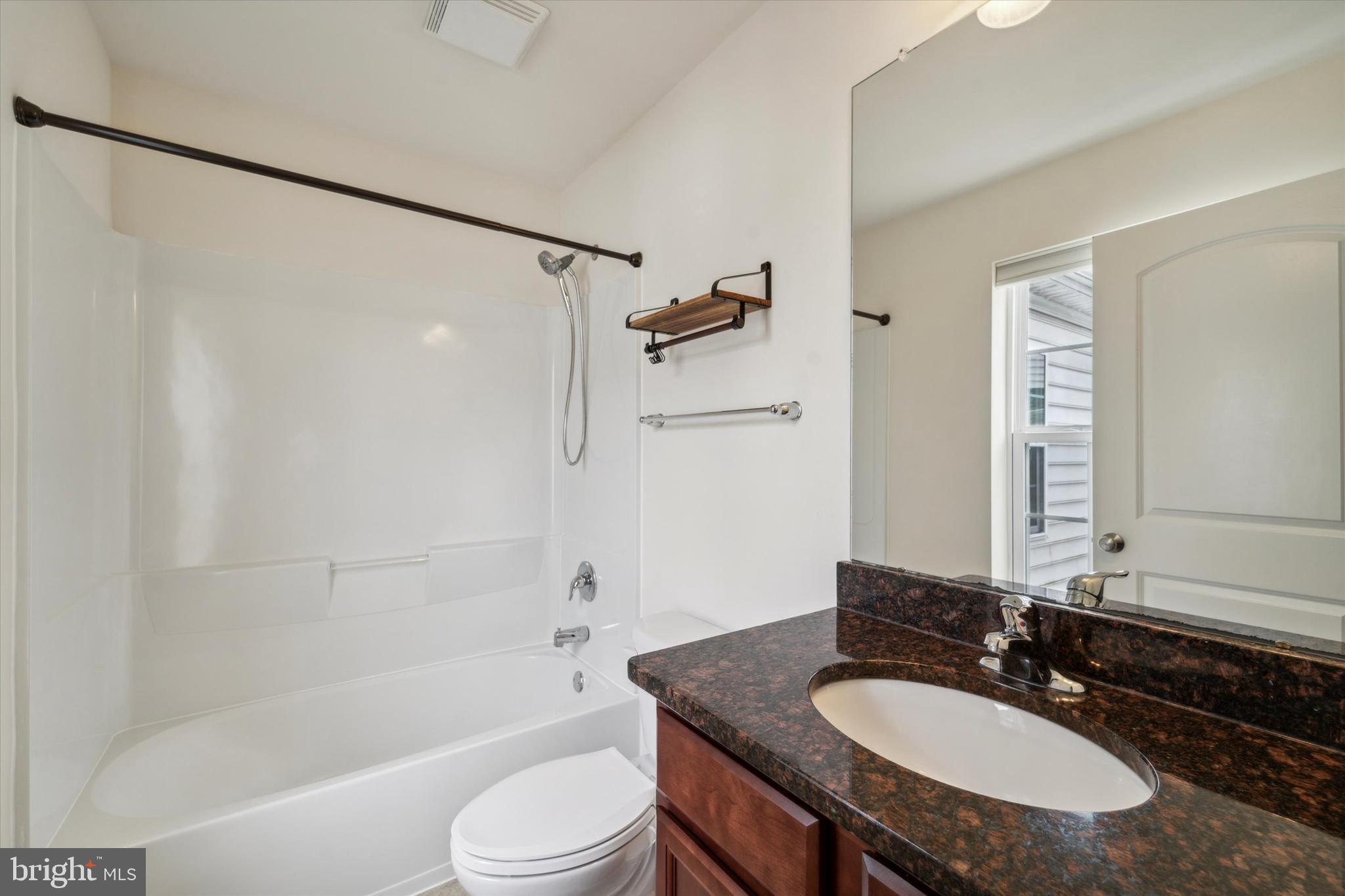 3799 Jacob Stout Road, Unit 5 Doylestown, PA 18902 - Photo 15 of 25 a bathroom with a granite countertop sink toilet and shower