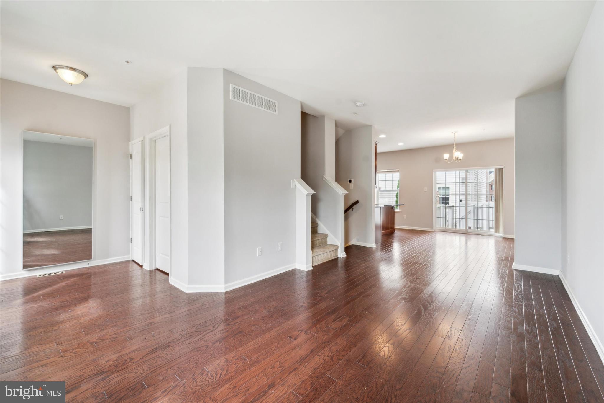 3799 Jacob Stout Road, Unit 5 Doylestown, PA 18902 - Photo 2 of 25 a view of an empty room and wooden floor