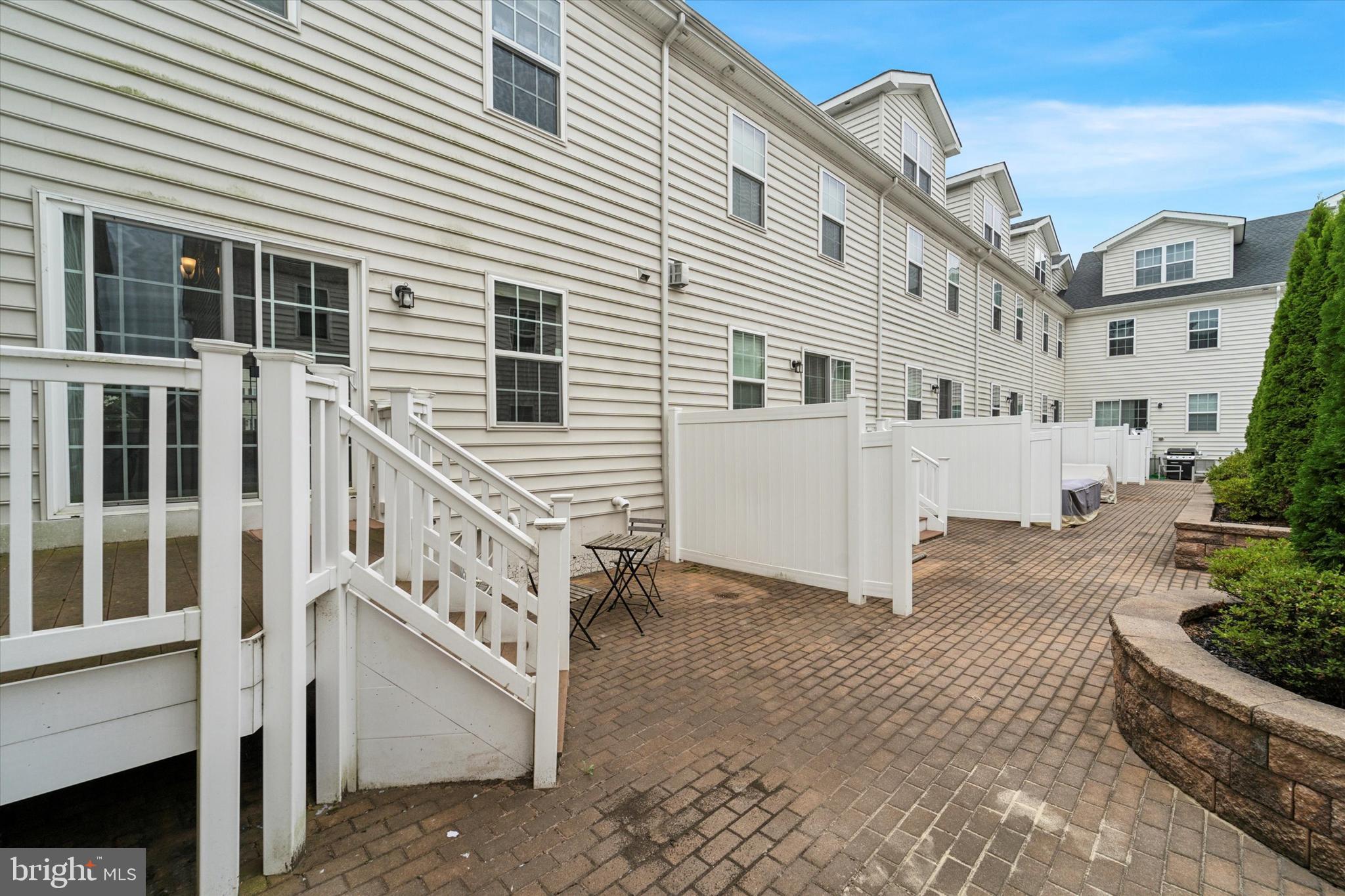 3799 Jacob Stout Road, Unit 5 Doylestown, PA 18902 - Photo 23 of 25 a view of a white building with large windows