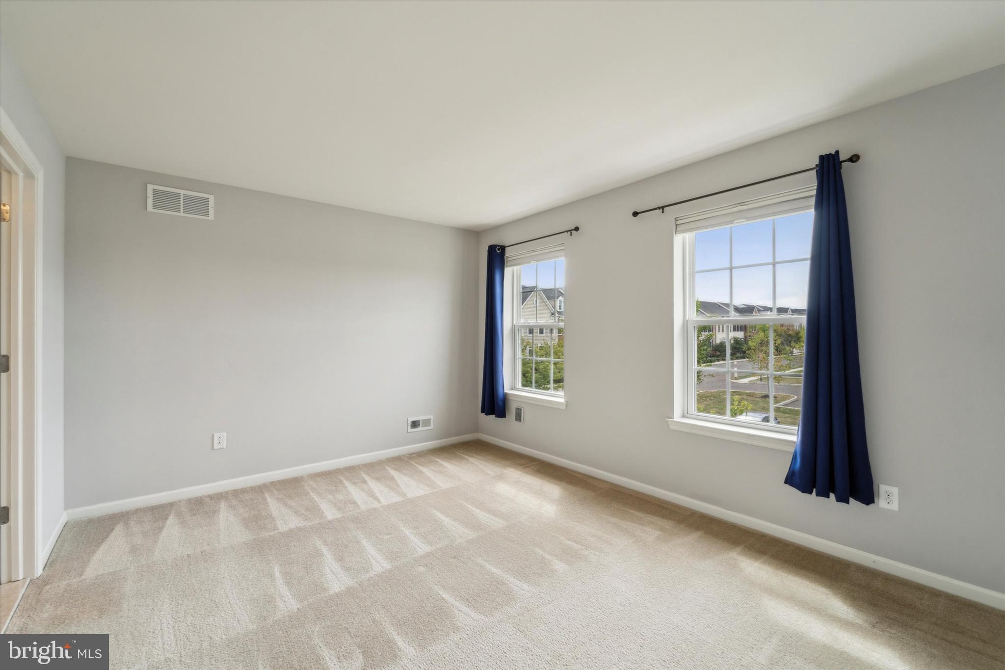 3799 Jacob Stout Road, Unit 5 Doylestown, PA 18902 - Photo 8 of 25 a view of an empty room with a window