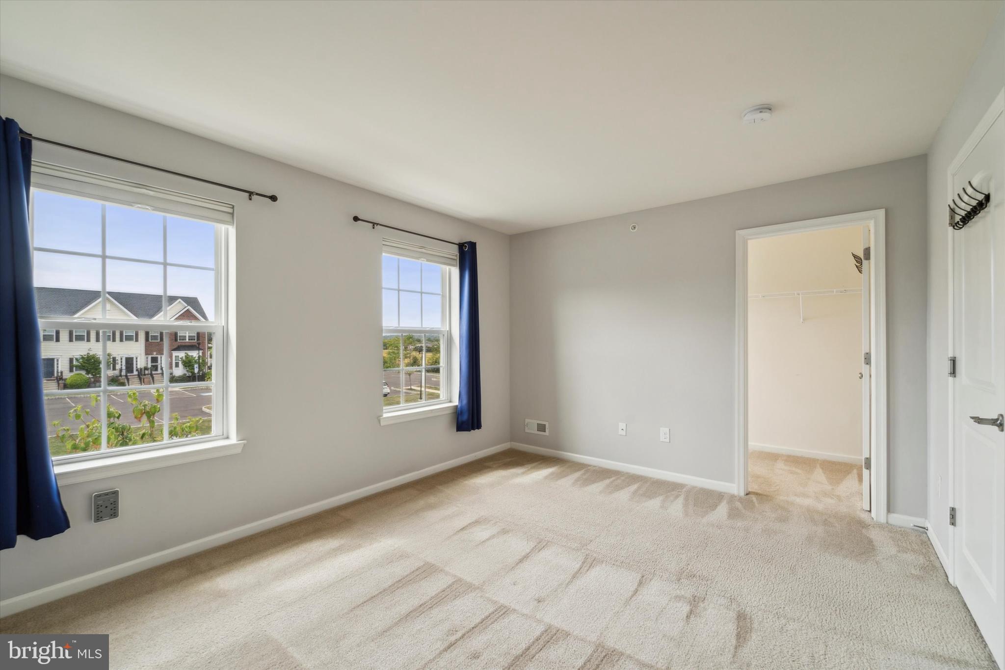 3799 Jacob Stout Road, Unit 5 Doylestown, PA 18902 - Photo 9 of 25 a view of an empty room with a window