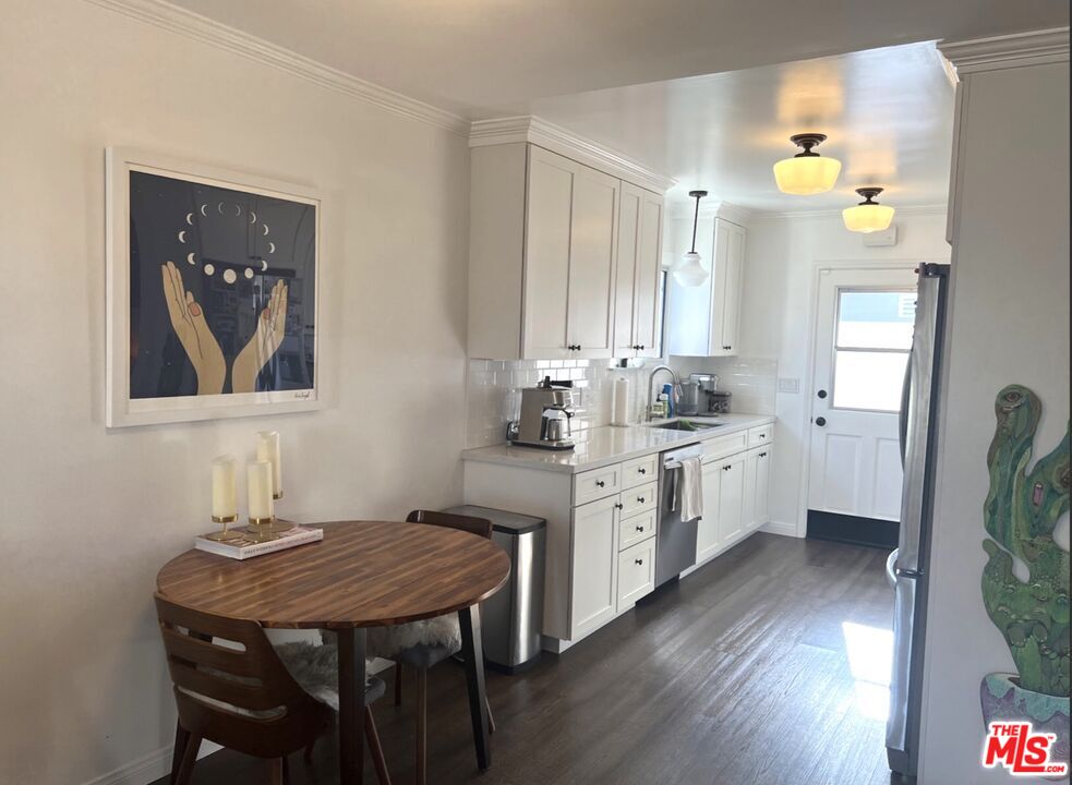 3125 Stanford Avenue Venice, CA 90292 - Photo 5 of 33 a kitchen with a table chairs sink and cabinets