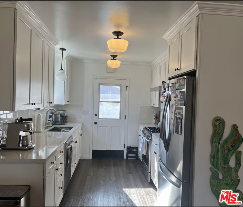 3125 Stanford Avenue Venice, CA 90292 - Photo 6 of 33 a kitchen with stainless steel appliances granite countertop a sink stove and refrigerator