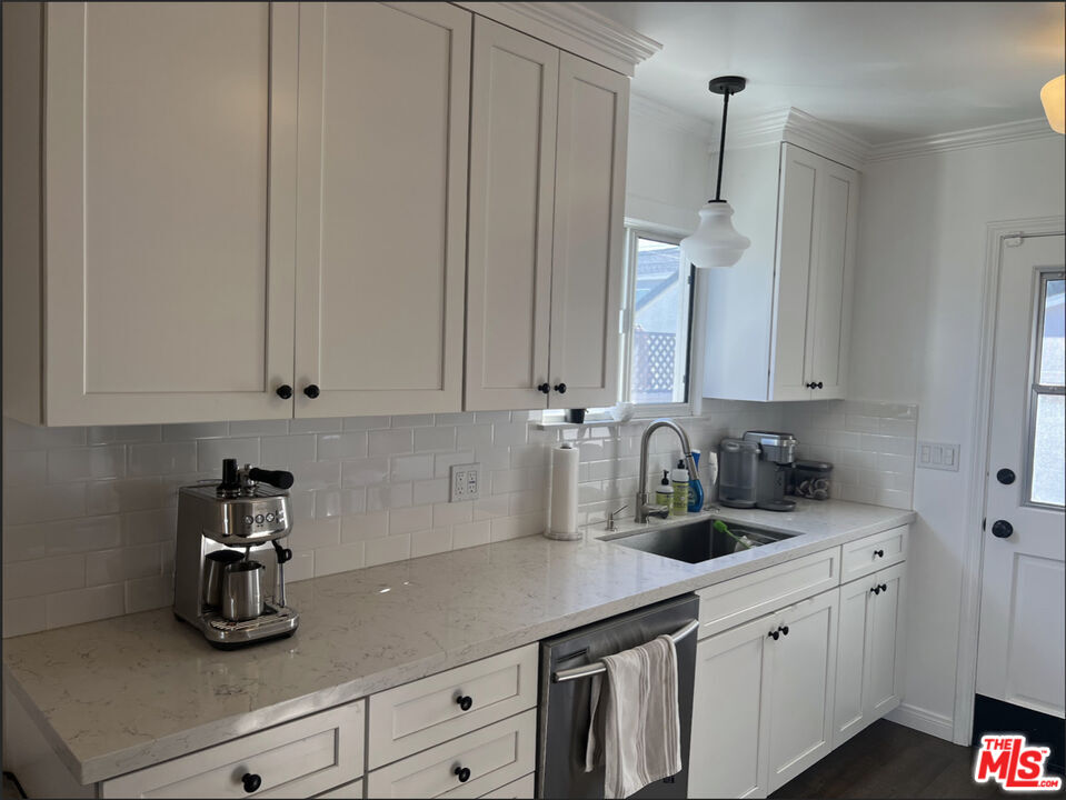 3125 Stanford Avenue Venice, CA 90292 - Photo 7 of 33 a kitchen with stainless steel appliances granite countertop white cabinets a sink and dishwasher