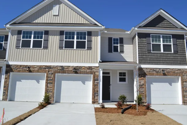 a front view of a house with a garage