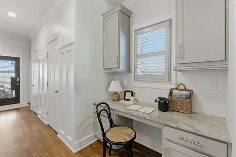 a kitchen with a table chairs and a refrigerator