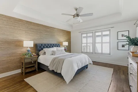 a spacious bedroom with a bed and a window