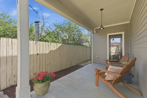 a view of an outdoor dining space with a patio