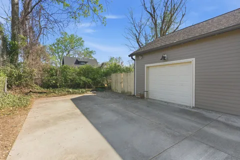 a view of a garage with a tree