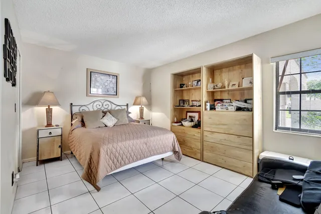 a bedroom with a bed and a cabinets