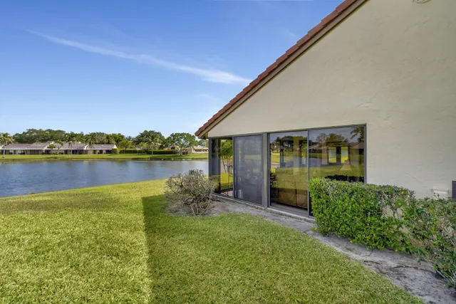 a view of a lake with houses in the back
