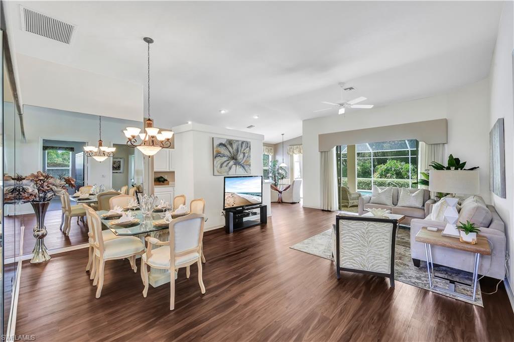 1721 Marsh Run Naples, FL 34109 - Photo 11 of 35 a living room with furniture and wooden floor