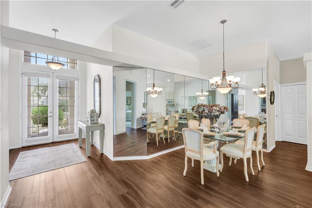1721 Marsh Run Naples, FL 34109 - Photo 13 of 35 a view of a dining room with furniture window and wooden floor