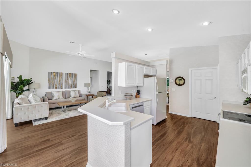 1721 Marsh Run Naples, FL 34109 - Photo 17 of 35 a view of living room with furniture and wooden floor