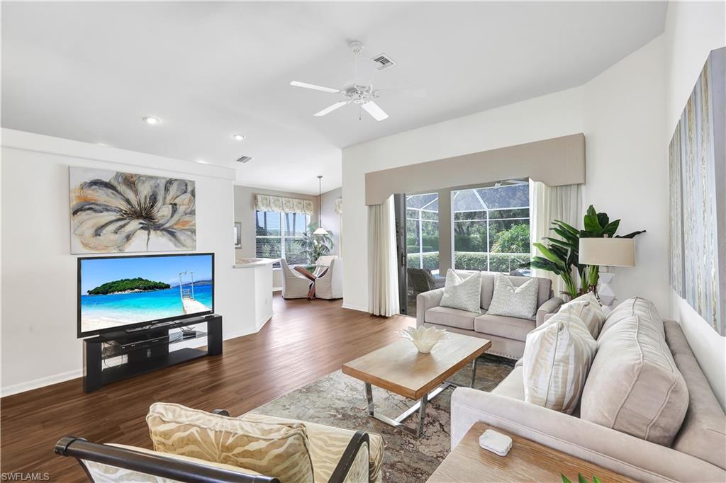 1721 Marsh Run Naples, FL 34109 - Photo 2 of 35 a living room with furniture and a flat screen tv
