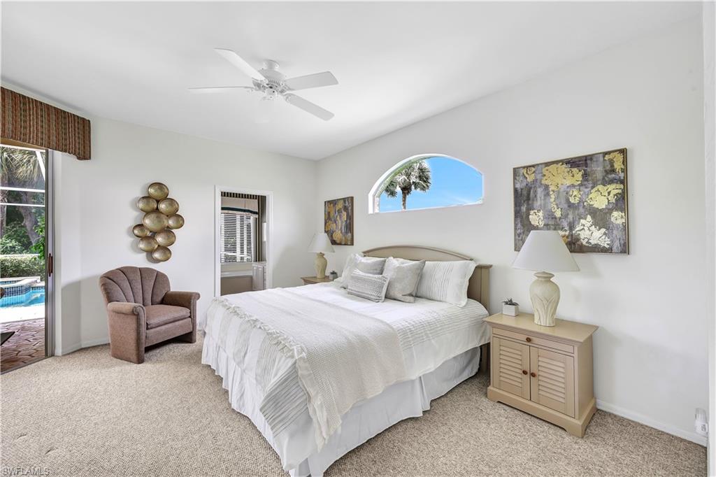 1721 Marsh Run Naples, FL 34109 - Photo 21 of 35 a bedroom with a bed and a couch