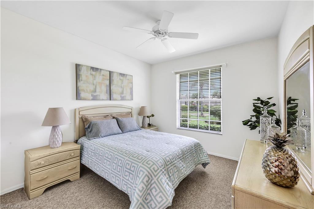1721 Marsh Run Naples, FL 34109 - Photo 25 of 35 a bedroom with a bed and a window