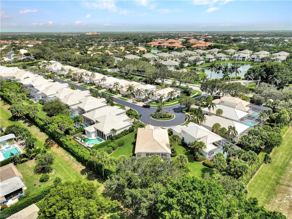 1721 Marsh Run Naples, FL 34109 - Photo 28 of 35 an aerial view of residential houses with outdoor space