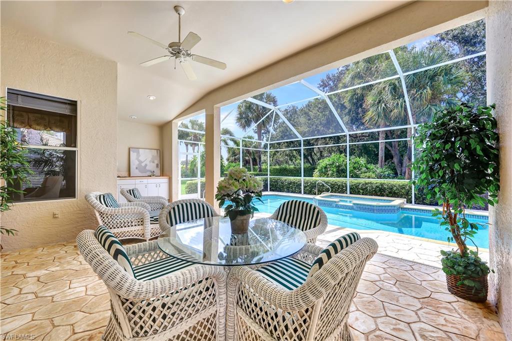 1721 Marsh Run Naples, FL 34109 - Photo 3 of 35 a view of a dining room and livingroom with furniture
