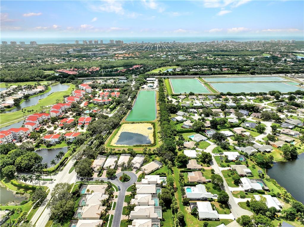 1721 Marsh Run Naples, FL 34109 - Photo 31 of 35 an aerial view of residential building and lake