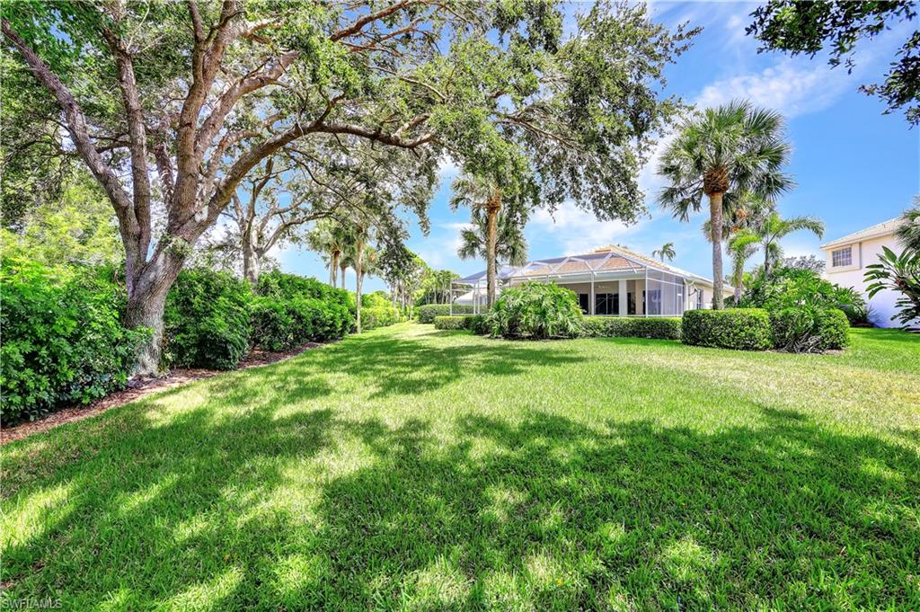 1721 Marsh Run Naples, FL 34109 - Photo 32 of 35 a view of backyard of house with green space