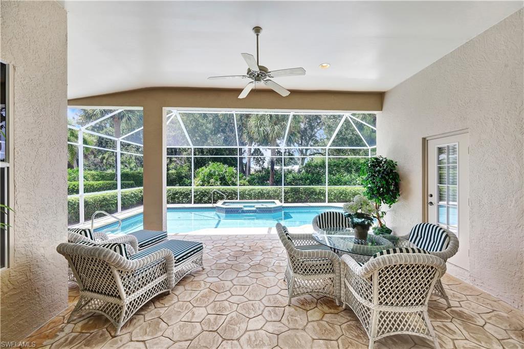 1721 Marsh Run Naples, FL 34109 - Photo 34 of 35 a living room with furniture and a large window