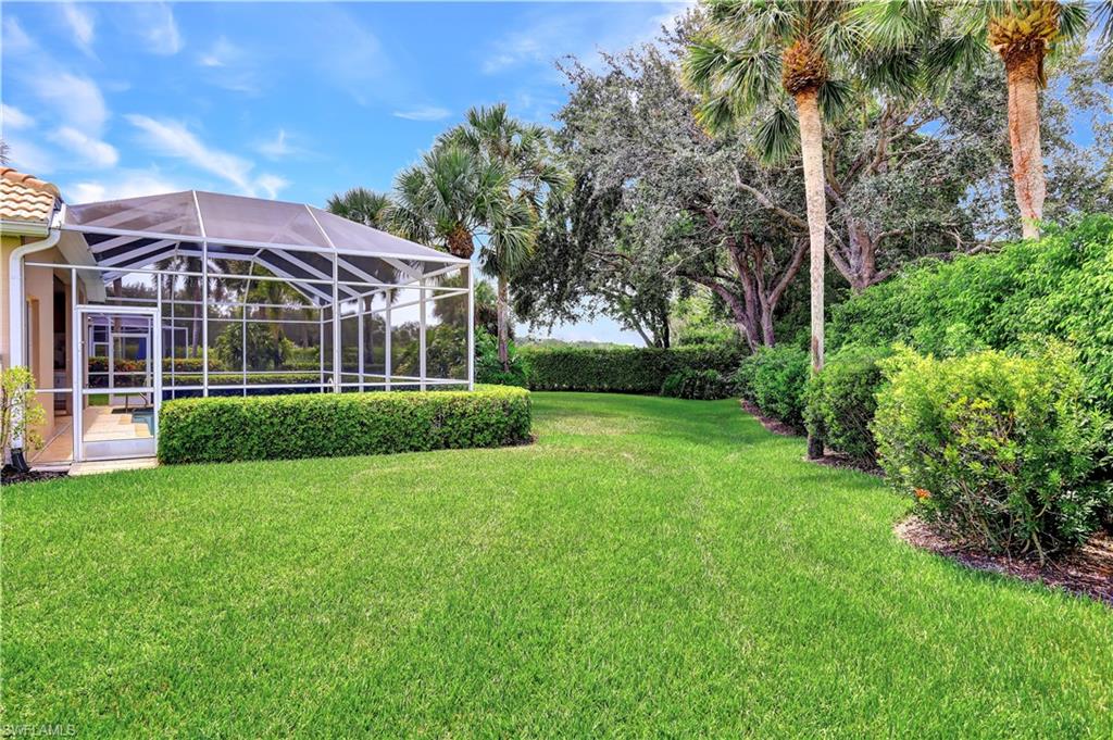 1721 Marsh Run Naples, FL 34109 - Photo 5 of 35 a front view of a house with a yard