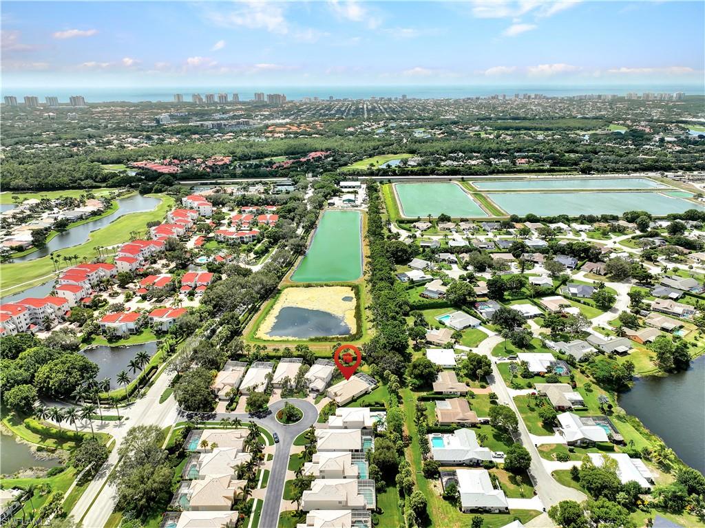 1721 Marsh Run Naples, FL 34109 - Photo 9 of 35 an aerial view of residential building and lake