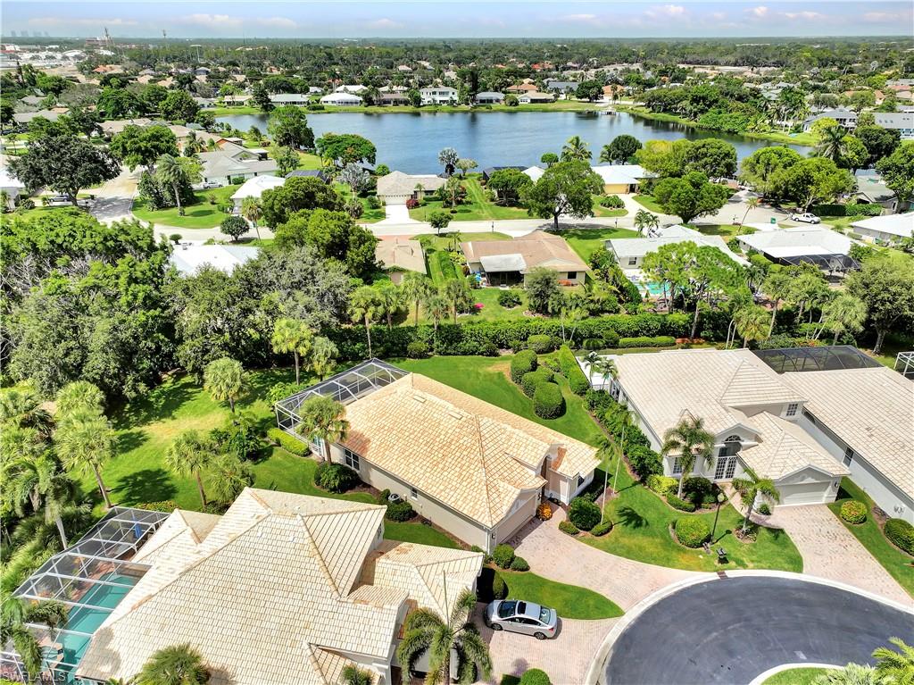 1721 Marsh Run Naples, FL 34109 - Photo 10 of 35 an aerial view of residential houses with outdoor space and trees