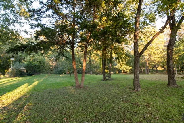 an aerial view of residential houses with outdoor space and swimming pool