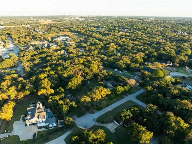 an aerial view of residential building and lake