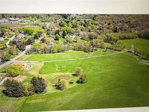 a view of a field with an outdoor space