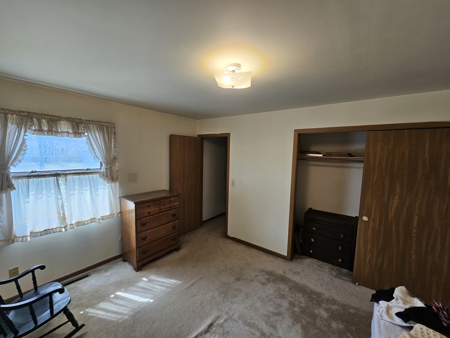 847-849 Rhodes Street Woodstock, IL 60098 - Photo 13 of 44 a room with furniture and a closet